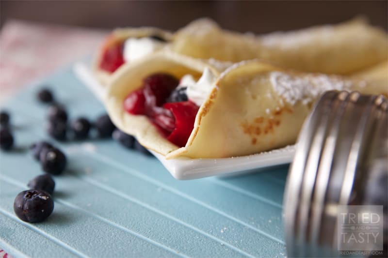 Front view of cherry blueberry breakfast crepes.
