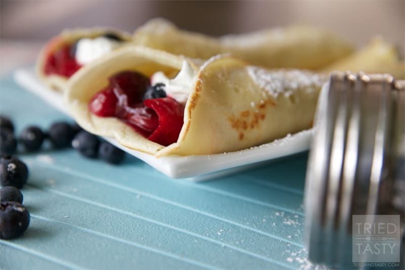Front view of cherry blueberry breakfast crepes.