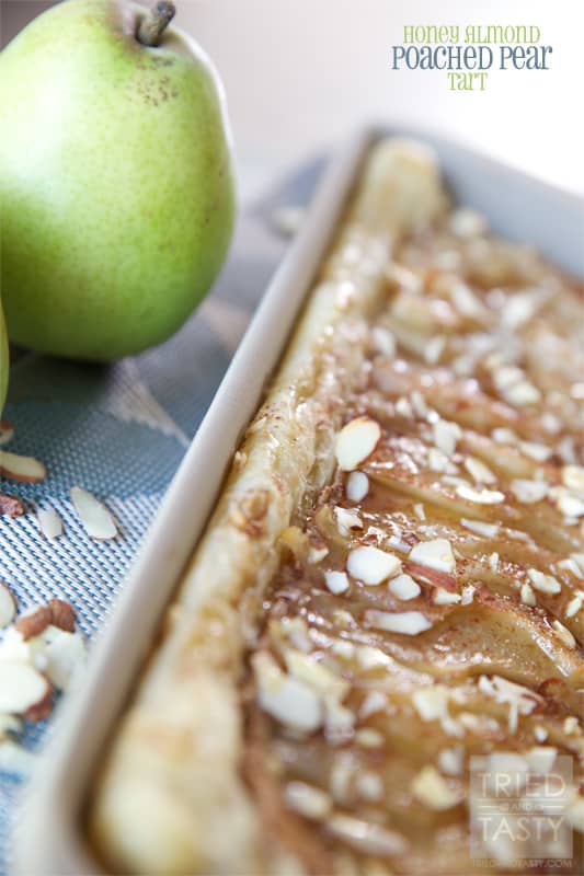Honey Almond Poached Pear Tart // This Honey Almond Poached Pear Tart is a fancy dessert that looks like you've slaved hours in the kitchen over. The best part about it? This gorgeous treat comes together with little effort. Your guests will be impressed and your belly will be satisfied! | Tried and Tasty