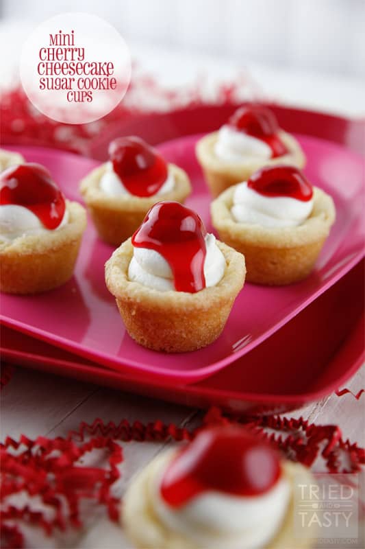 Mini Cherry Cheesecake Sugar Cookie Cups // These delicious little bite-sized bits of heaven are perfect for Valentine's Day! They are mini, fit right in the palm of your hand, and will be gobbled up in no time. With the tiniest hint of coconut, you'll be left wanting more! | Tried and Tasty